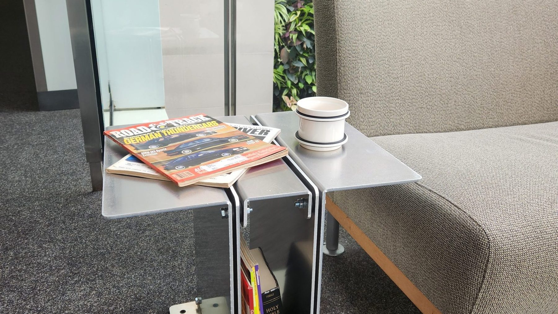 3082 on concrete holding books and a mug